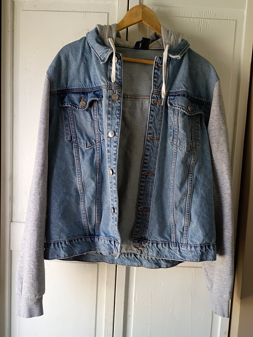 DIVIDED Light Blue Denim Jacket with Gray Hood.